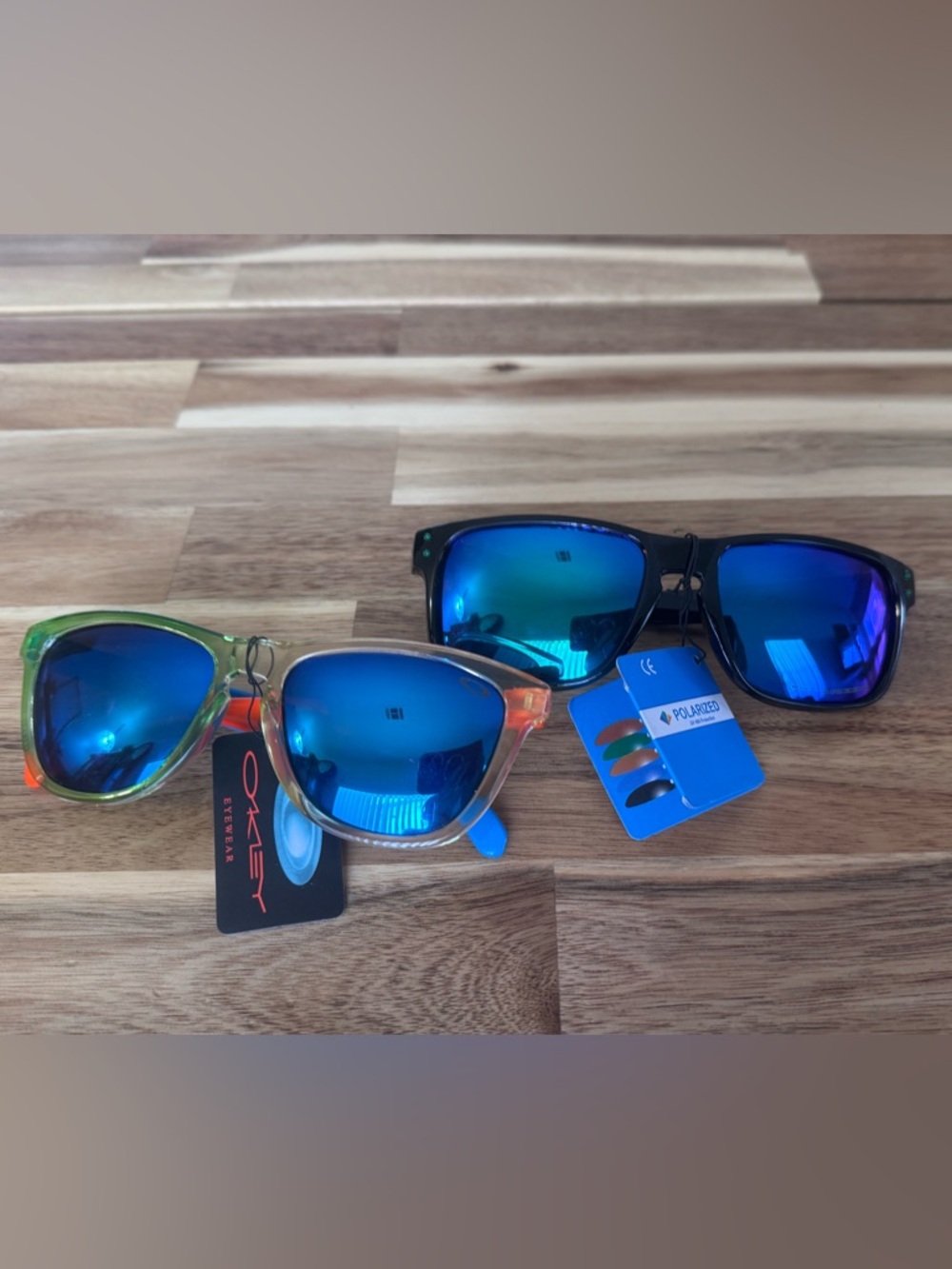 2 Oakley style kids Sunglasses polarized lenses. Not sure if authentic NWT